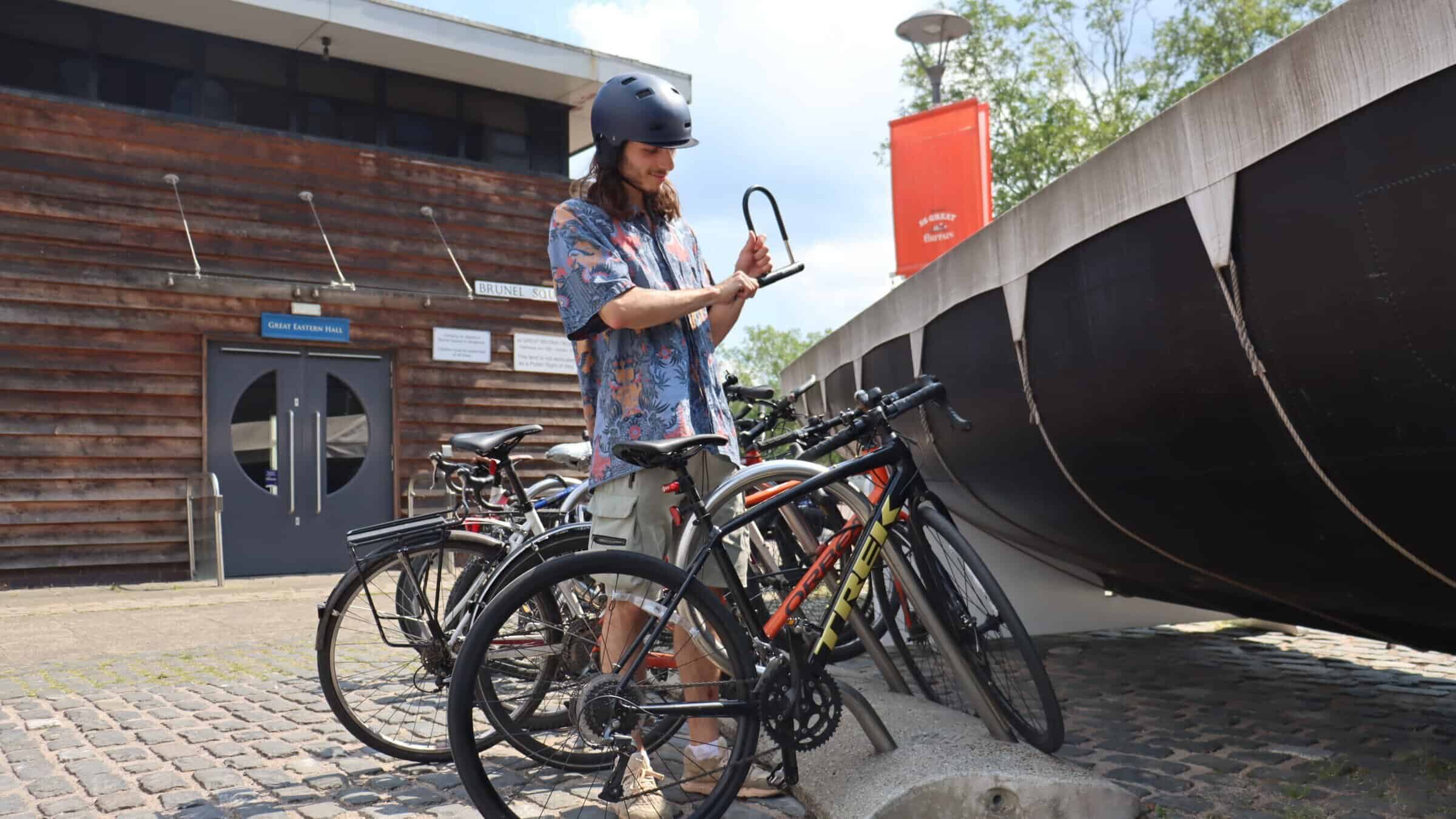 Visitor riding bike to work sustainability on board